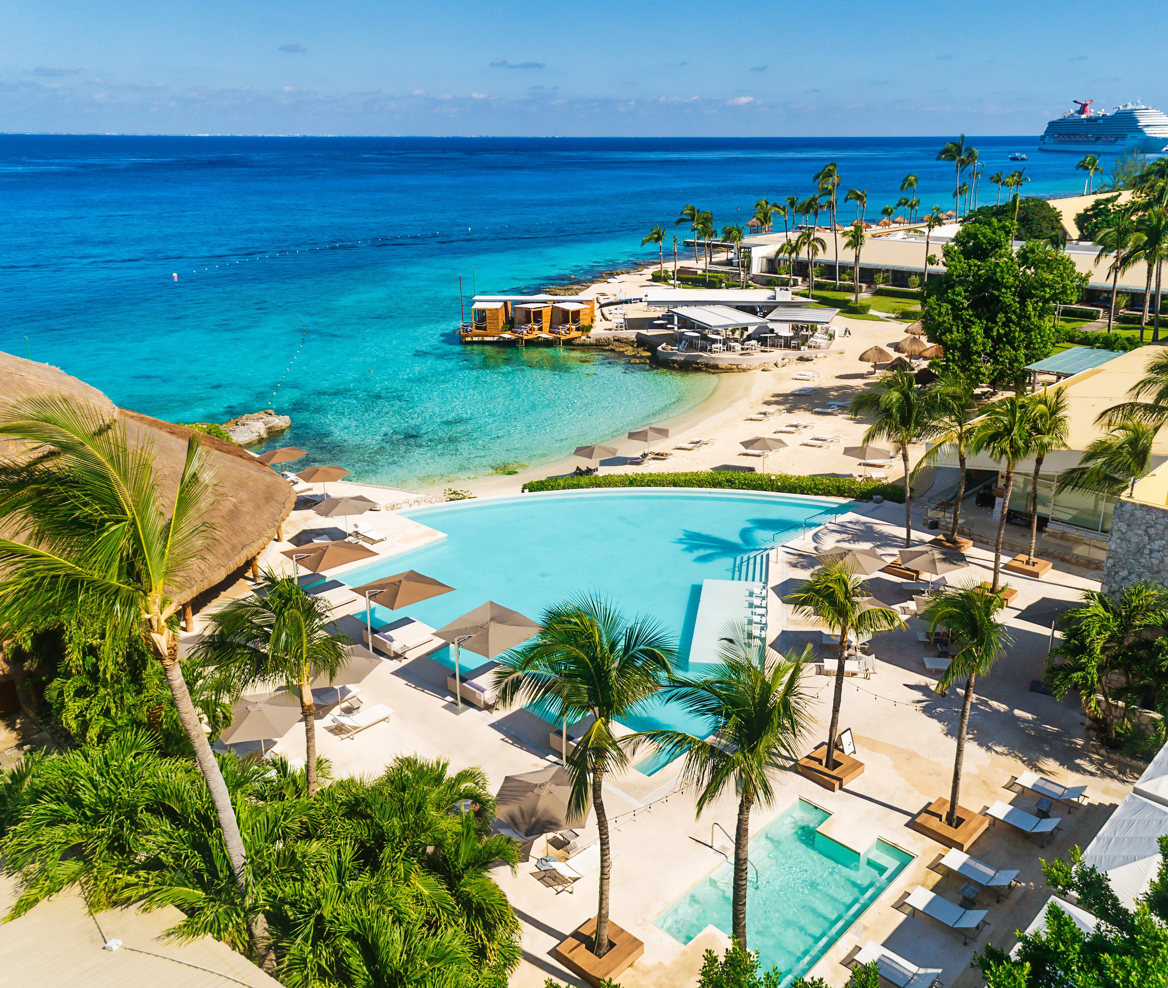 Caribbean beach and main pool at the best resort in Cozumel Mexico